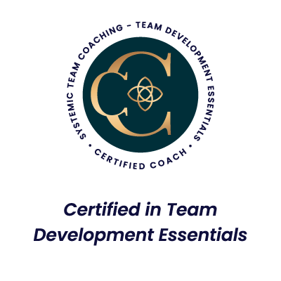 Systemic Team Coaching - Team Development Essential Badge on black cirle with gold lettering.