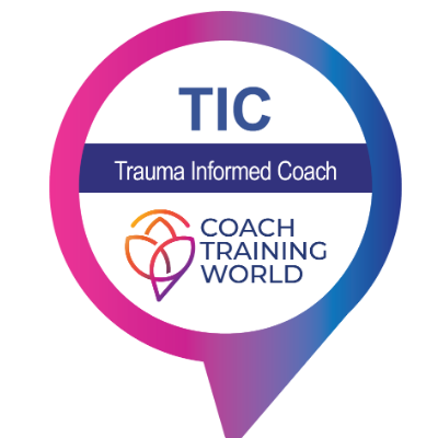 Trauma Informed Coach Badge from Coach Training World showing in blue and fuschia pink colours.